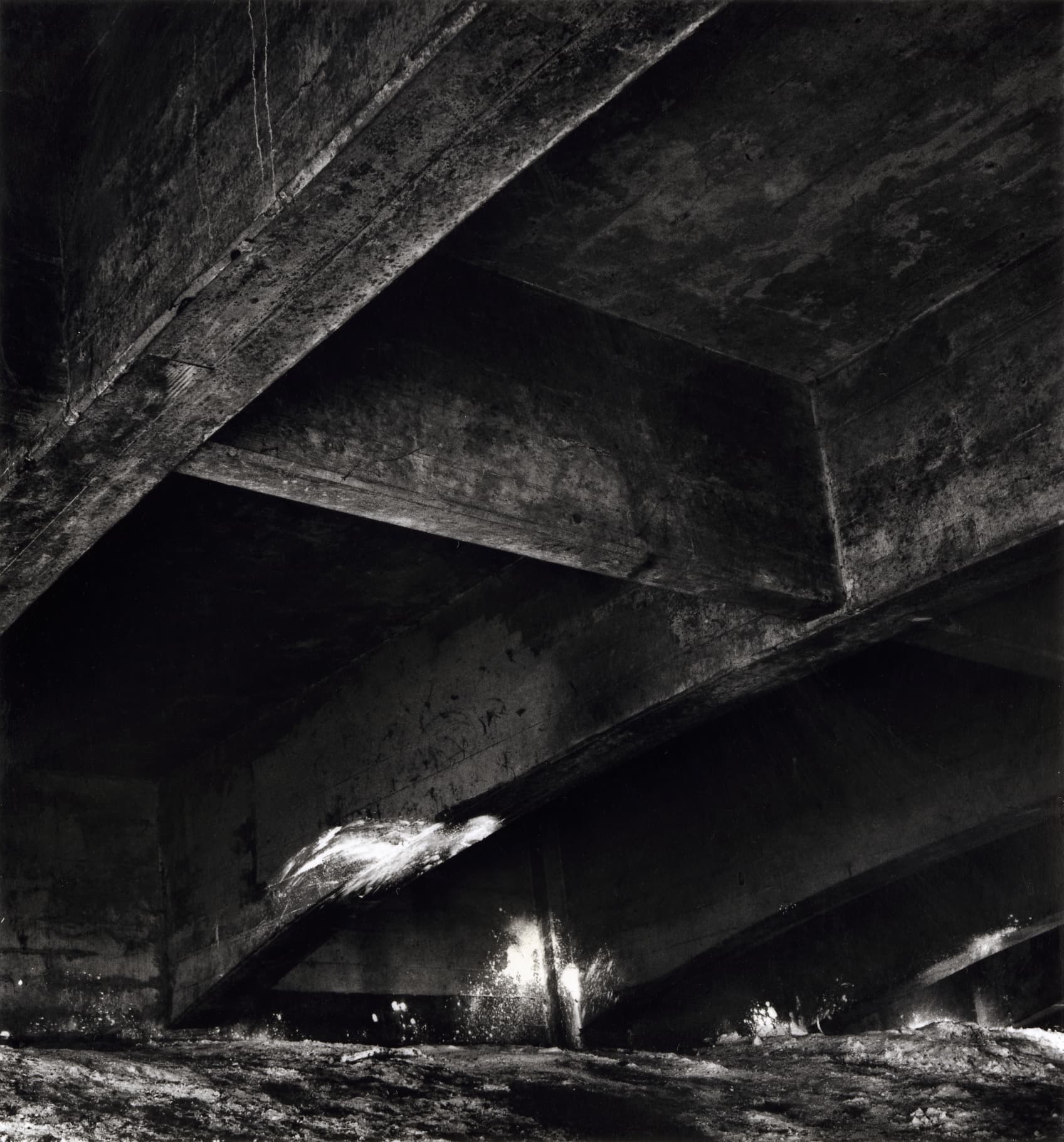 Black and white film photograph from under overpass